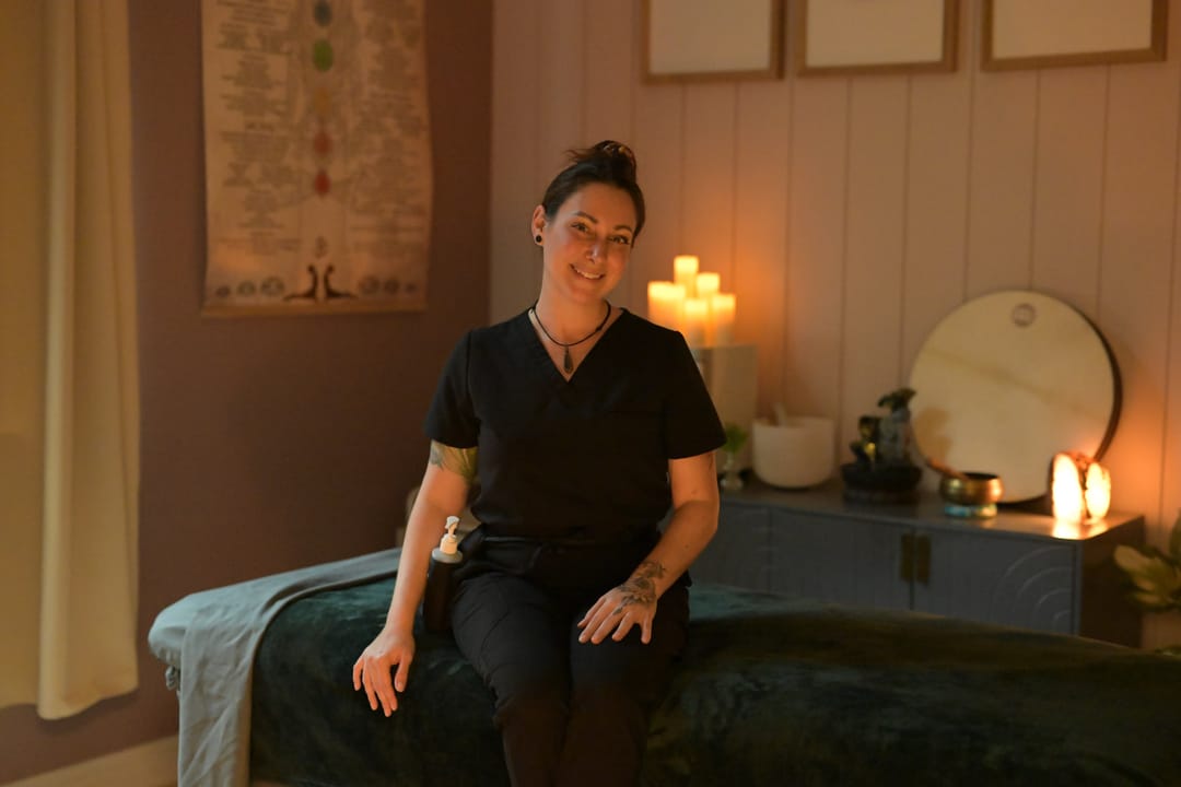 Massage table with folded heated towels in Krysta Smith's studio in New Port Richey